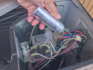 Sub Zero Temp Control - Run Capacitor: Technician replacing run capacitor in air conditioner