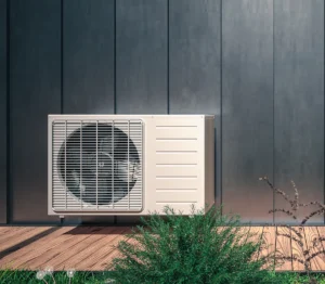 Outdoor ductless mini split heat pump installed outside a modern home
