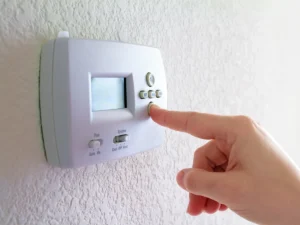 How to reset a Honeywell thermostat on a wall-mounted control